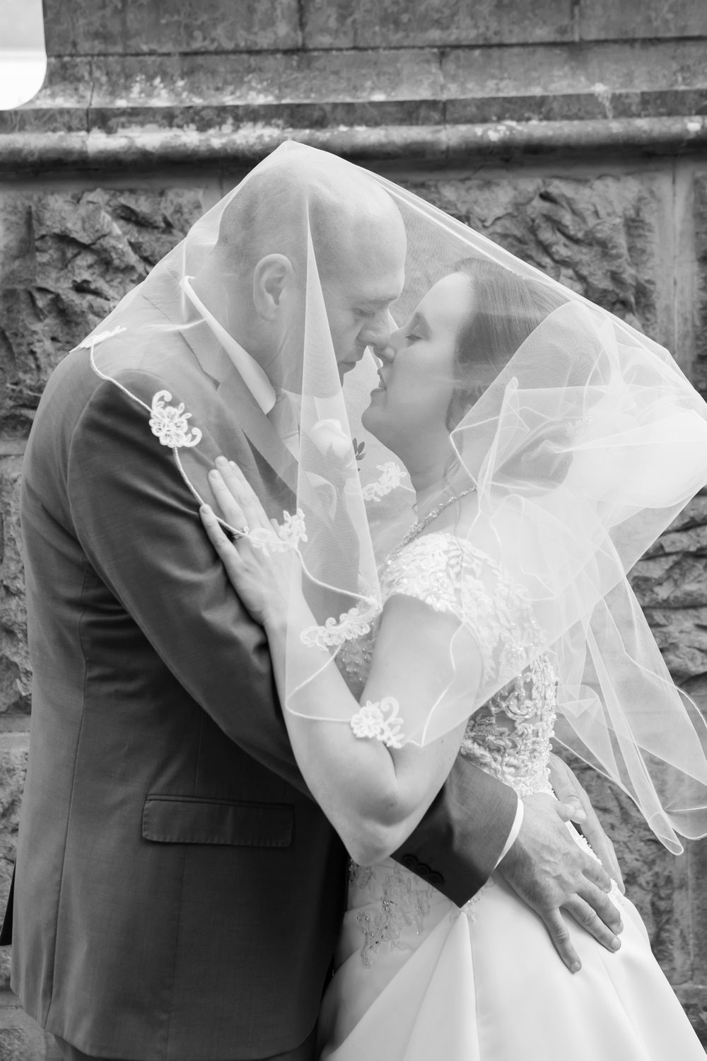 Bride and Groom under the wedding veil