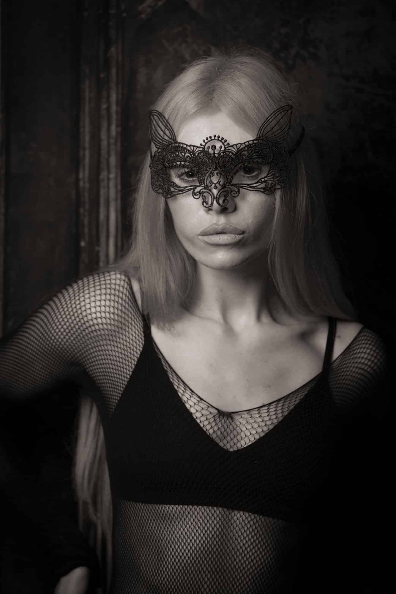 boudoir photograph taken in a carlisle studio showing a lady in black underwear wearing a mask