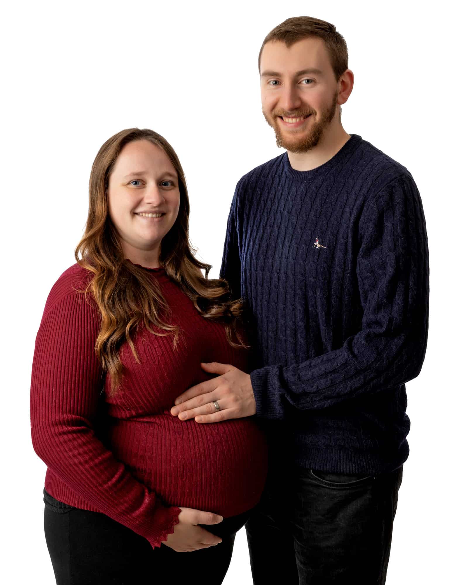 Pregnant lady with her partner during a maternity photosession